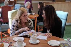 Care home residents lend an ear to young storytellers
