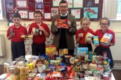 Nether Alderley children put harvest food on the table