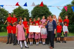 Pupils carry buckets of water to raise money for Kenyan school