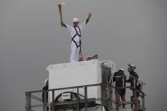 John Bishop carries Olympic Torch to top of Jodrell Bank