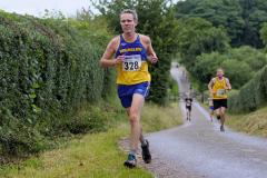 Runners race along the paths and trails on The Edge