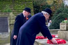 Villagers pays their respects to the fallen