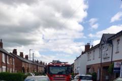 Parked cars block firefighters