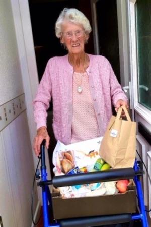 Ada receiving food parcel from Age UK