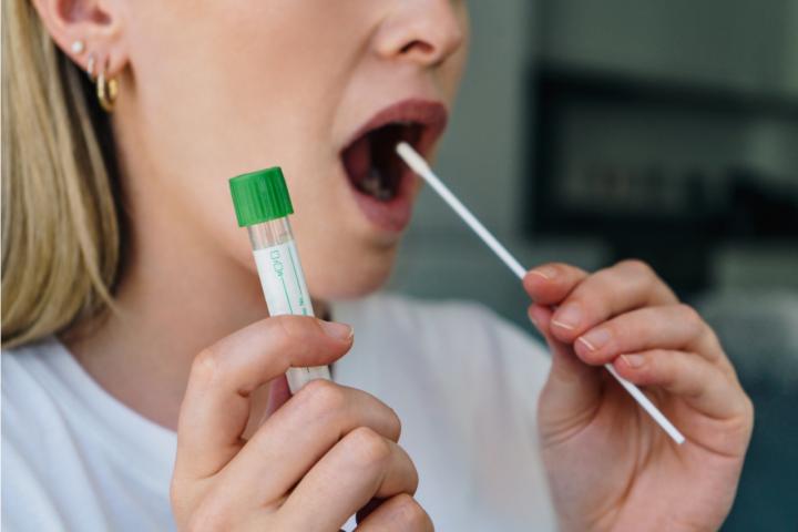 Woman taking a lateral flow test